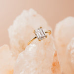 emerald cut diamond engagement ring with double claws in yellow gold