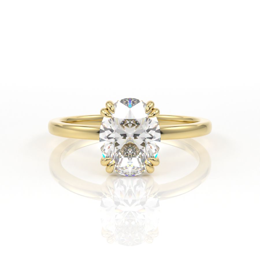 Double claw oval solitaire engagement ring in yellow gold