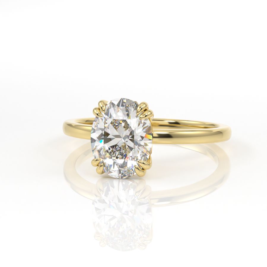 Double claw oval solitaire engagement ring in yellow gold