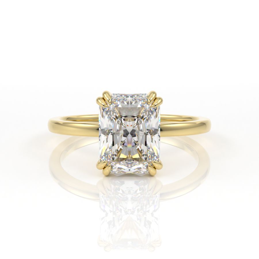 Double claw solitaire engagement ring with radiant cut diamond centre