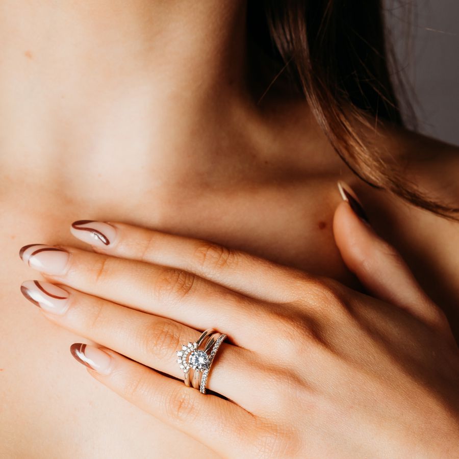 white gold double halo crown ring with white gold solitaire engagement ring and diamond wedding ring