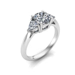 white gold 3 stone diamond engagement ring with a round centre stone and trilliant triangle shape side stones