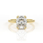 Elongated cushion cut diamond solitaire engagement ring with double claws