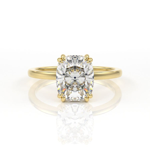 Elongated cushion cut diamond solitaire engagement ring with double claws