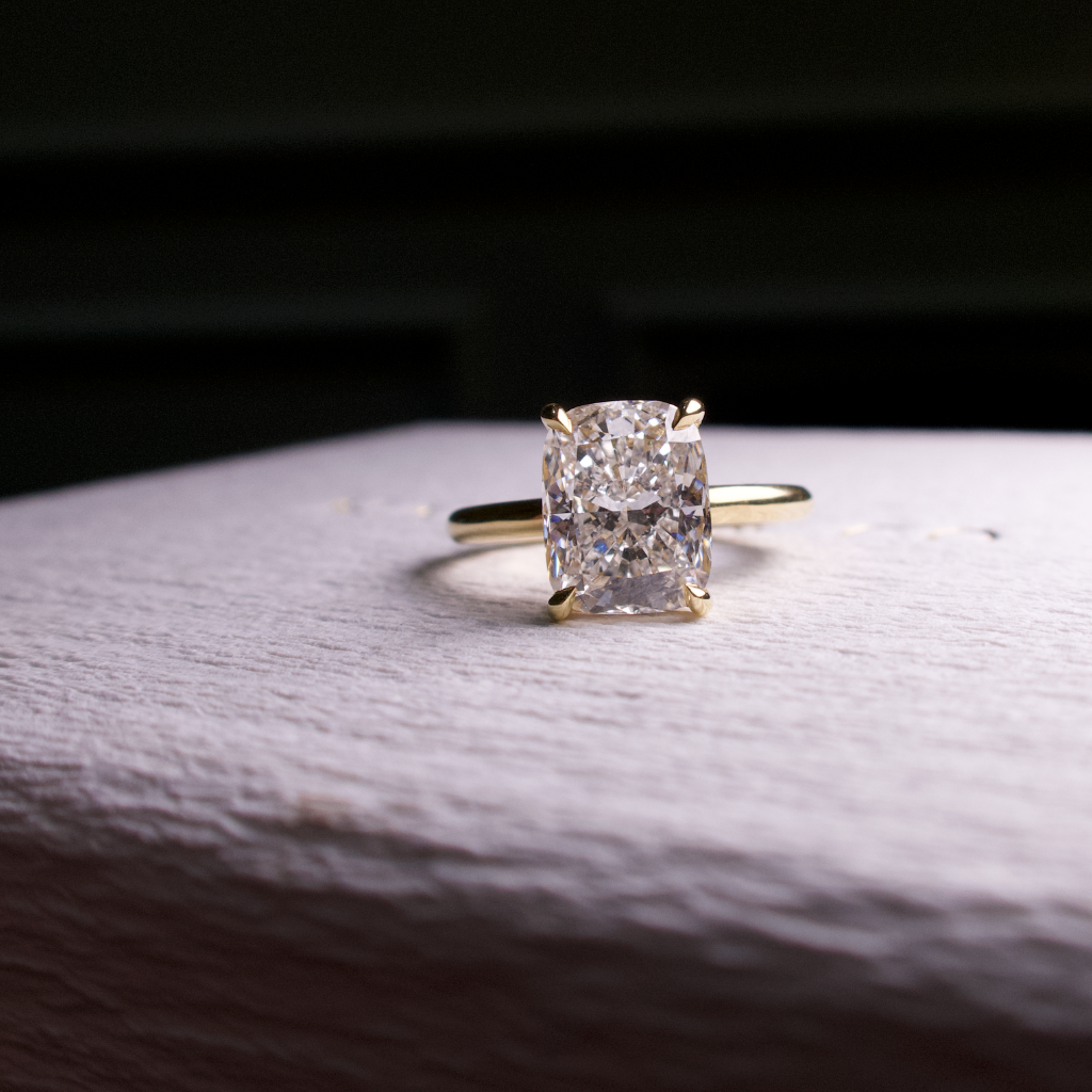 elongated solitair cushion cut with hidden halo