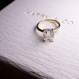 elongated solitaire cushion cut with hidden halo gold