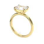 Emerald cut diamond set at east west
