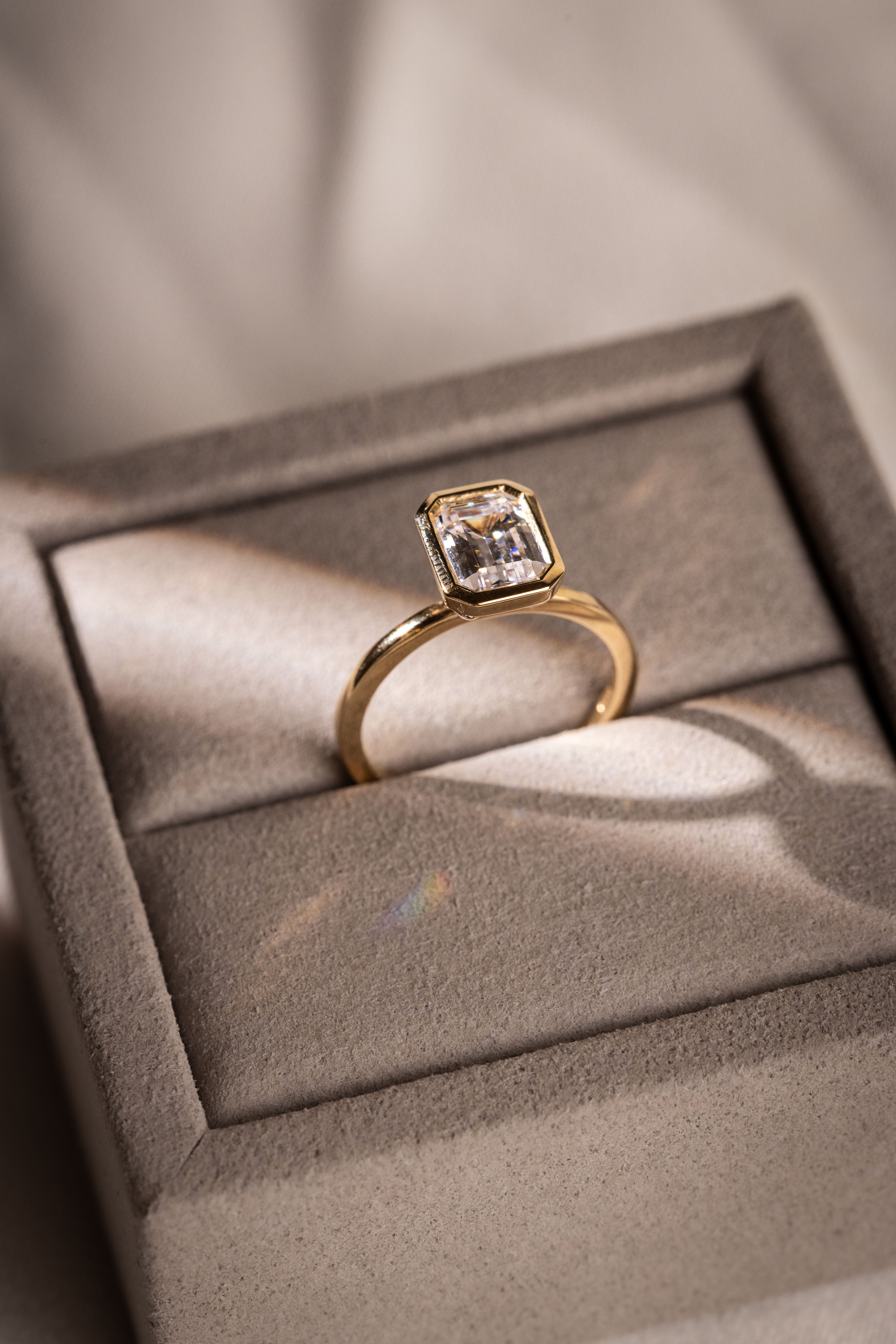 emerald bezel cut gold engagement ring
