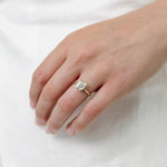 emerald cut diamond bezel set engagement ring
