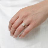 emerald cut diamond bezel set engagement ring