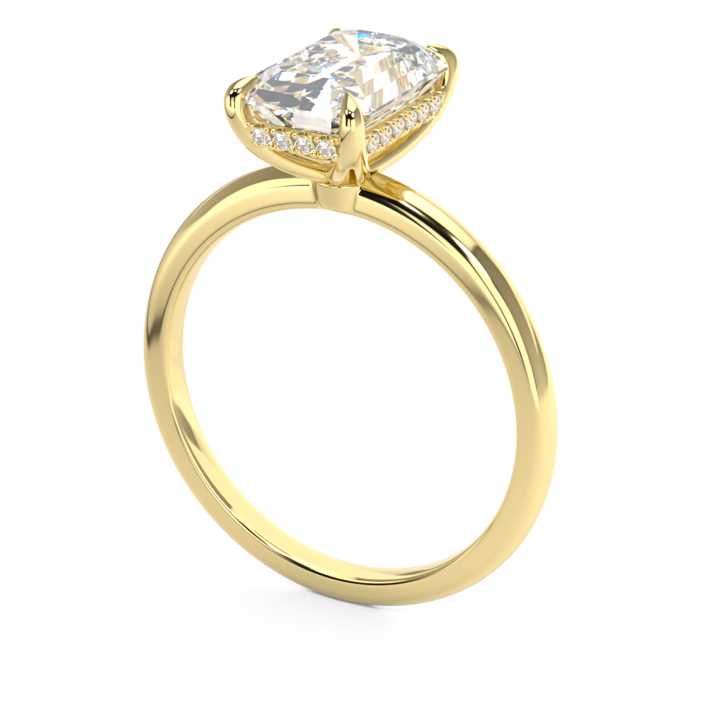 emerald cut diamond solitaire engagement ring with hidden halo in yellow gold