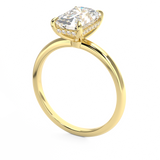 emerald cut diamond solitaire engagement ring with hidden halo in yellow gold