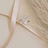 White gold round solitaire engagement ring and white gold diamond wedding ring