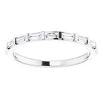 eternity ring with baguette cut diamonds in white gold 
