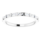 eternity ring with baguette cut diamonds in white gold 