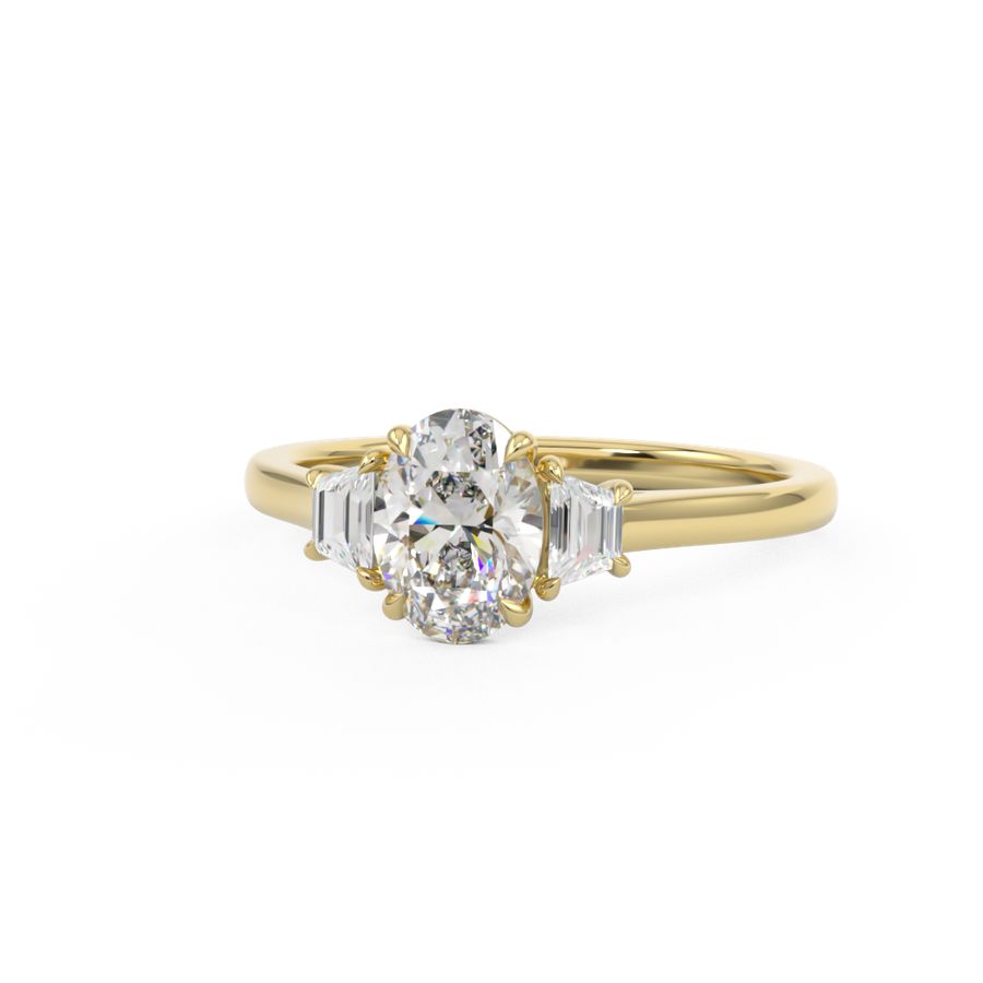Oval Trilogy Three stone ring with trapezoid side stones in yellow gold
