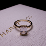  half bezel emerald diamond engagement ring 