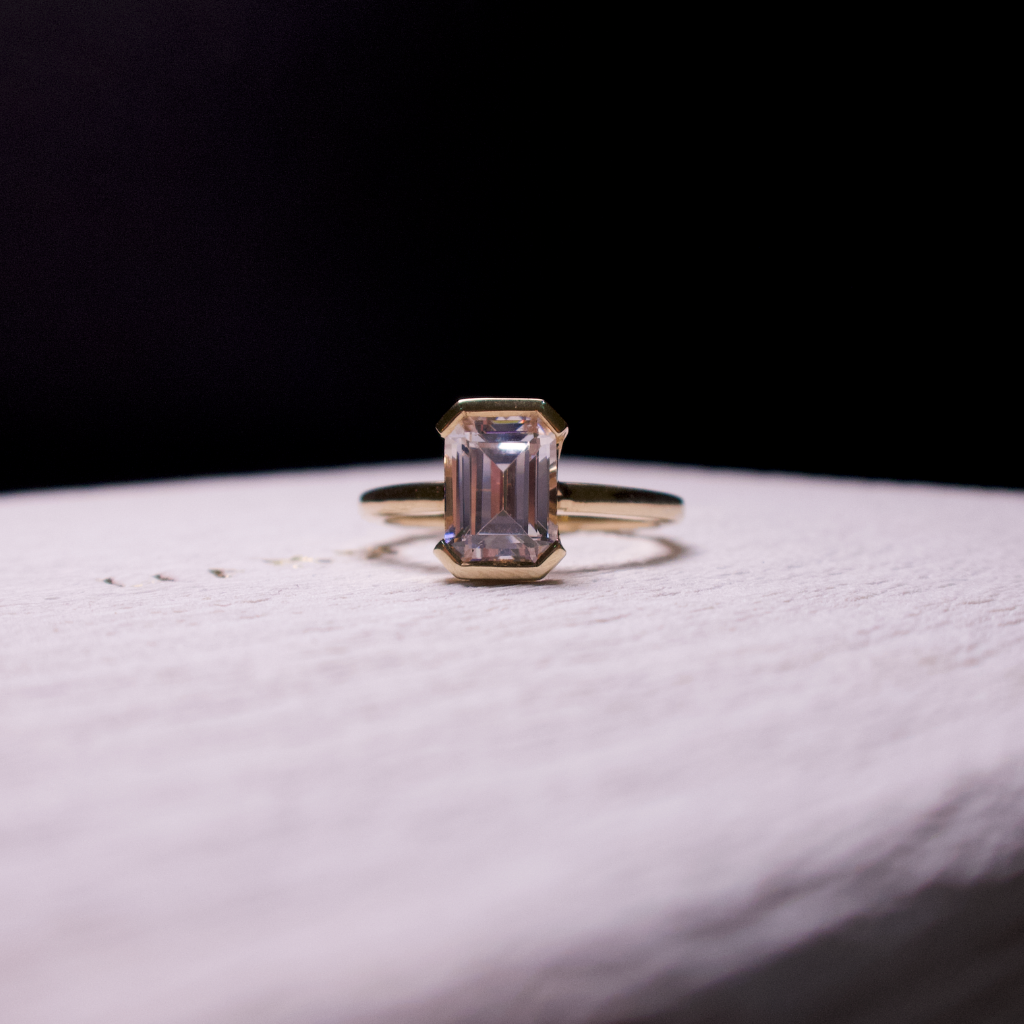  half bezel emerald diamond ring 