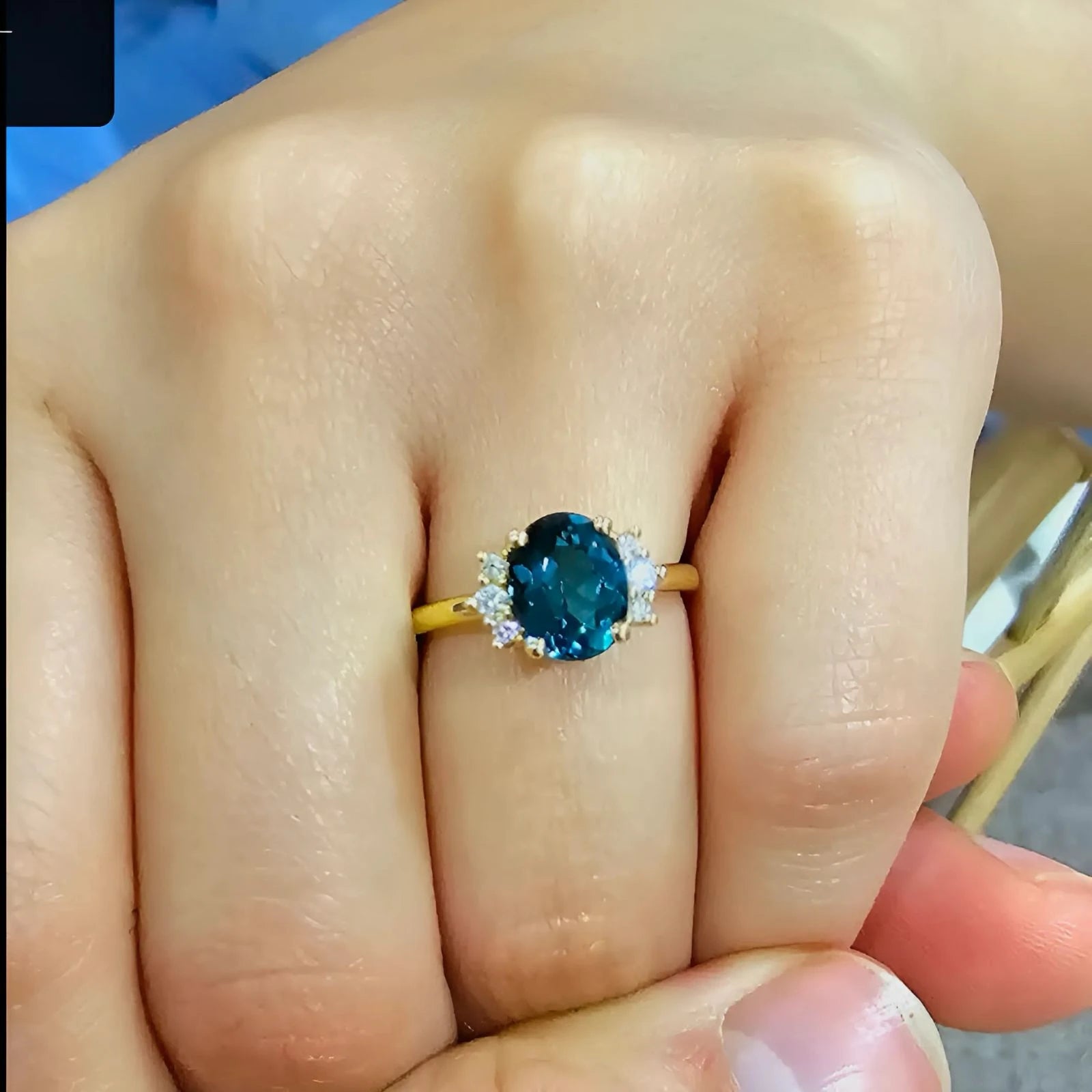 Custom blue sapphire engagement ring with diamond clusters by Harry & Co Adelaide