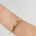 Gold crossover bangle

