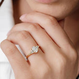 three stone engagement ring with oval centre diamond