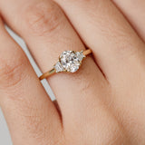 Trilogy three stone engagement ring with oval centre diamond