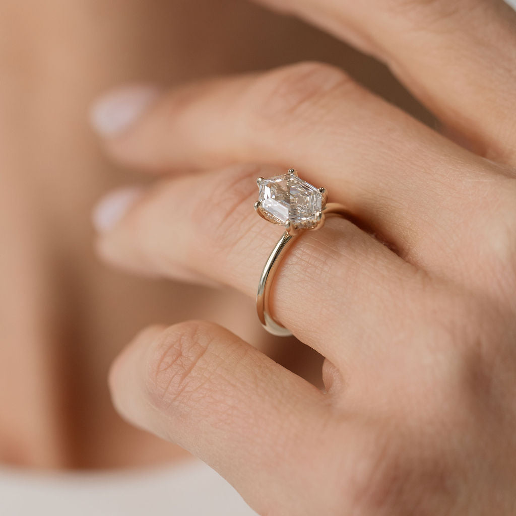 hexagonal cut diamond solitaire engagement ring
