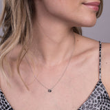 silver disc pendant with engraved letter