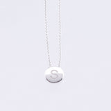 White gold disc pendant with engraved letter