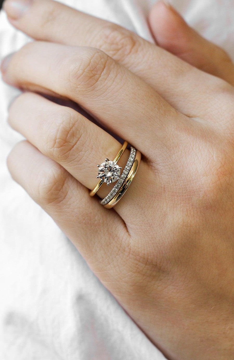 yellow gold round solitaire engagement ring with white gold diamond ring and yellow gold wedding ring