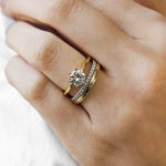 yellow gold round solitaire engagement ring with white gold diamond ring and yellow gold wedding ring