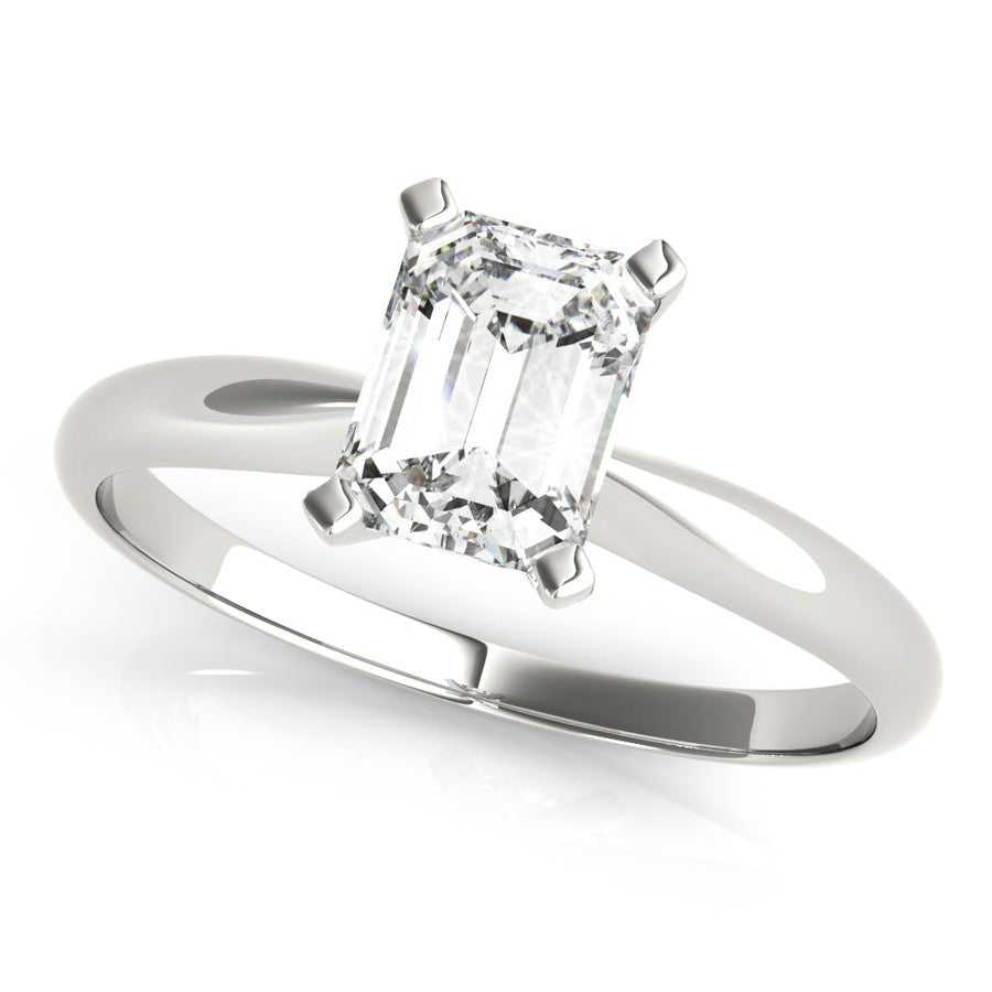 White gold tapered engagement ring with emerald cut moissanite