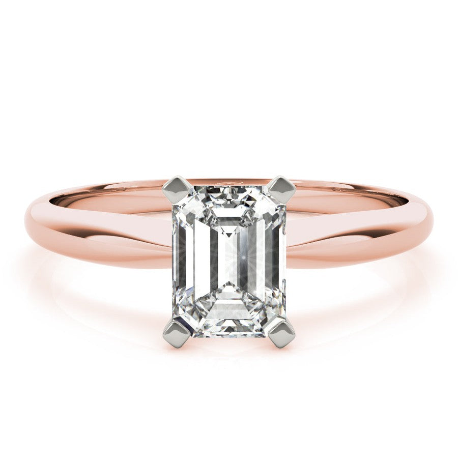 Rose gold tapered engagement ring with emerald cut moissanite