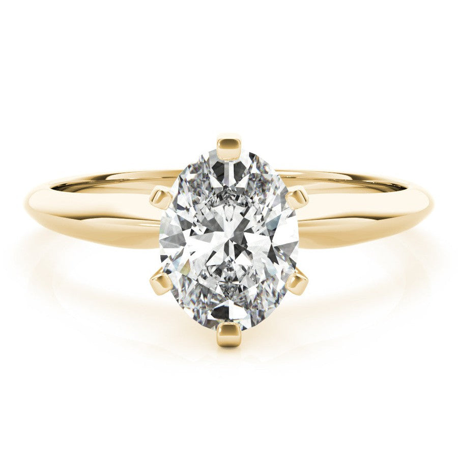 Yellow gold tapered solitaire engagement ring with oval moissanite