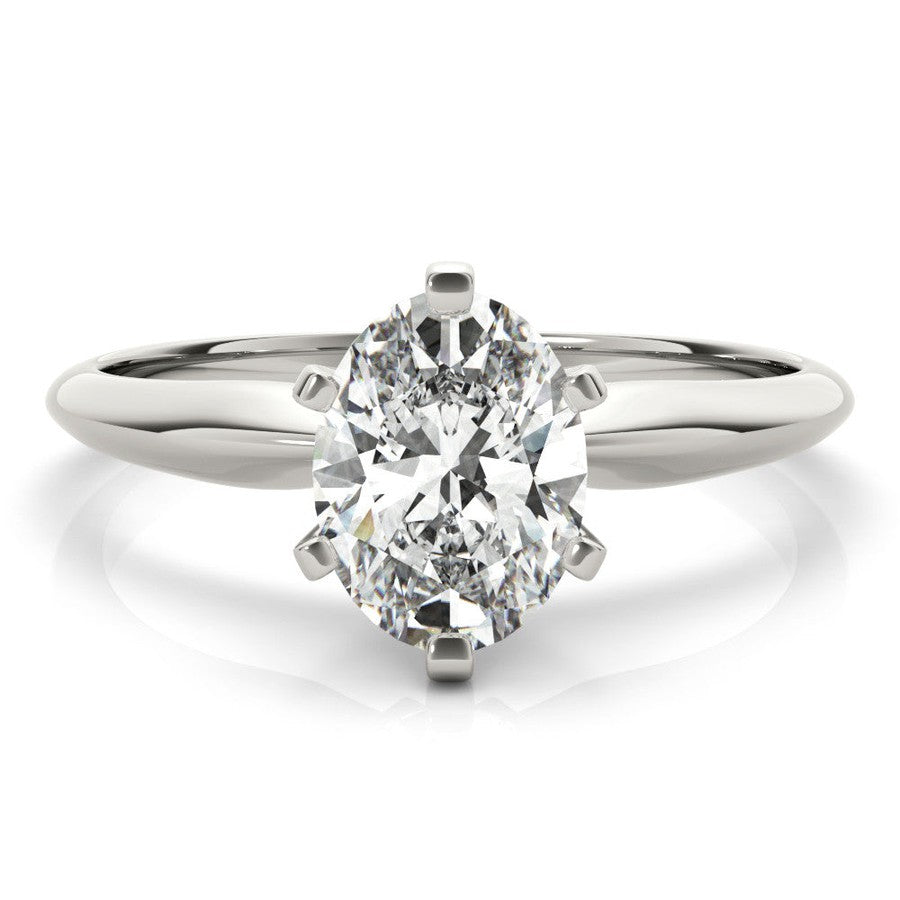 White gold tapered solitaire engagement ring with oval moissanite