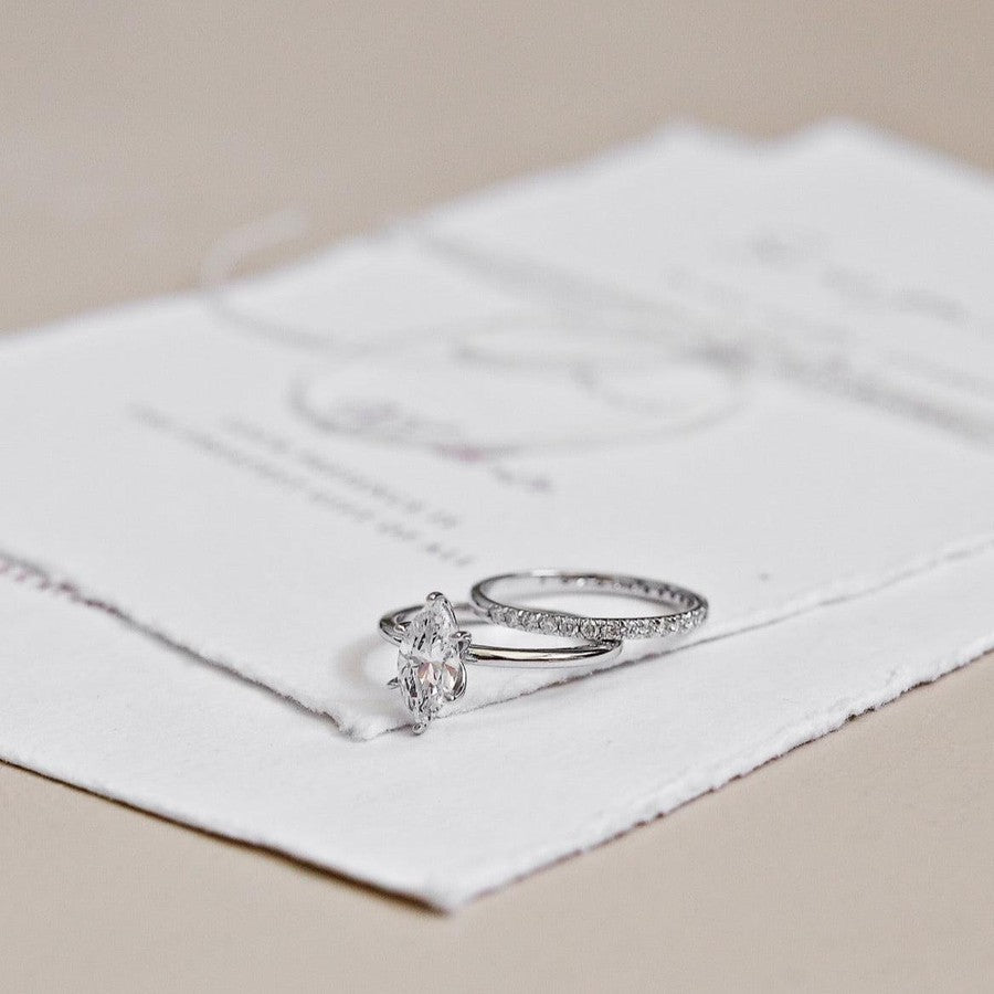 White gold diamond wedding ring and white gold marquise shape diamond engagement ring