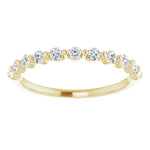 yellow gold diamond wedding ring with single claws and round diamonds