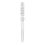 white gold diamond wedding ring with single claws and round diamonds