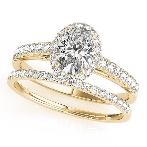 Oval diamond engagement ring with diamond halo and diamonds in the band