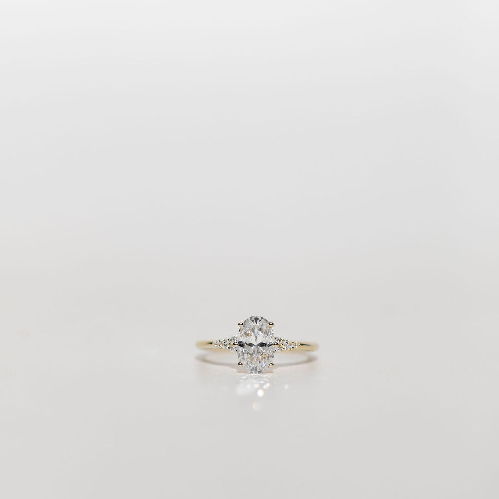 oval cut diamond engagement ring with diamonds on the band