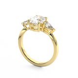Three Stone Trilogy Diamond engagement ring with oval cut diamond centre stone and pear cut diamond side stones