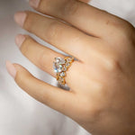 pear shape wedding ring alternating  with gold