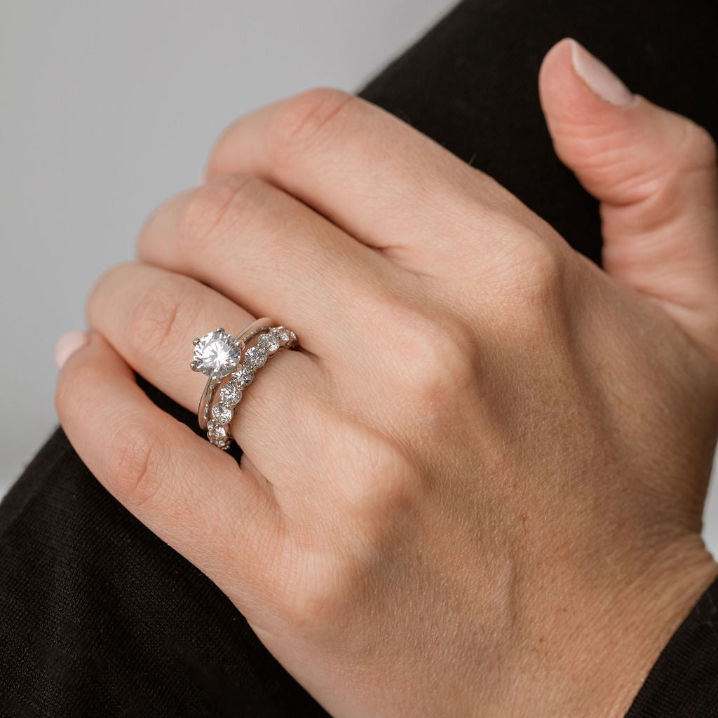 classic knife edge solitaire engagement ring with statement diamond wedding ring