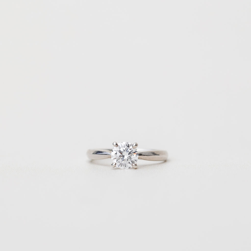 platinum solitaire engagement ring with tapered in band
