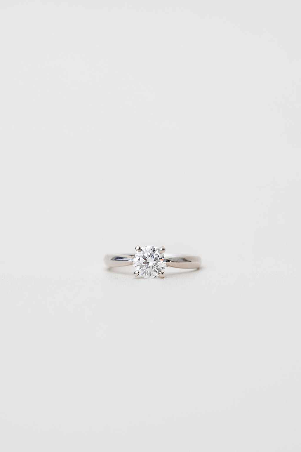 platinum solitaire engagement ring with tapered in band