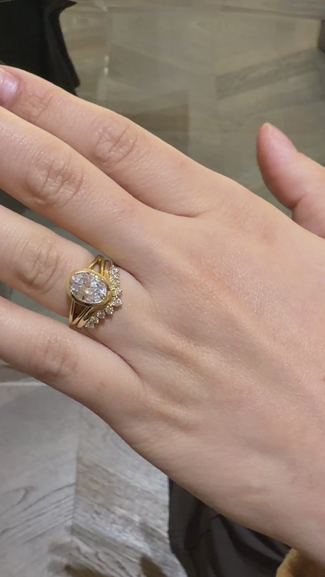 Bezel set oval diamond engagement ring with v shape diamond wedding ring