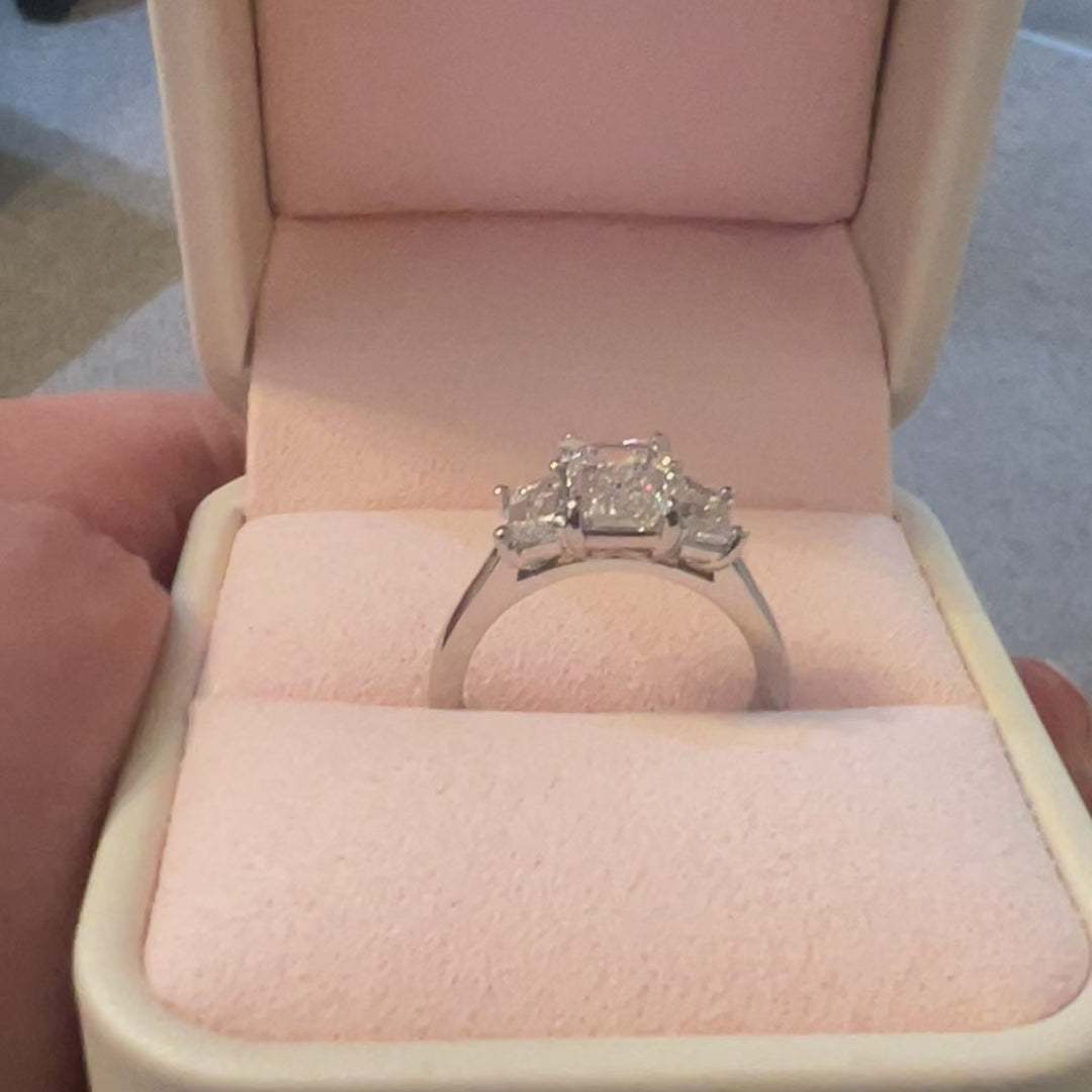 3 stone emerald cut diamond ring