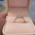 3 stone emerald cut diamond ring