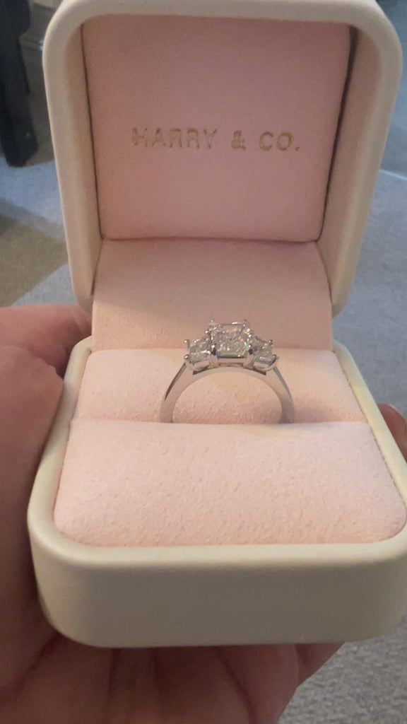 3 stone emerald cut diamond ring