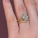 curved wedding ring crown ring with pear shape diamond at the centre